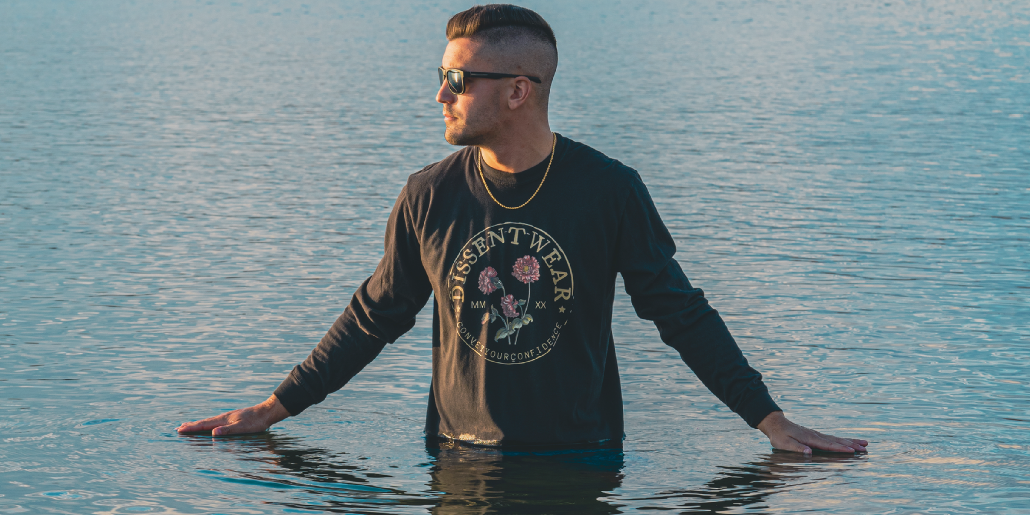 DISSENT WEAR vintage logo long sleeve on model in water in maine