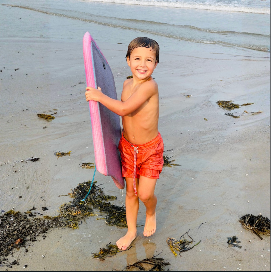 boy in swim shorts for dissent wear brand